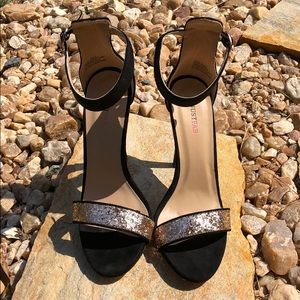 Gold glitter and black stilettos